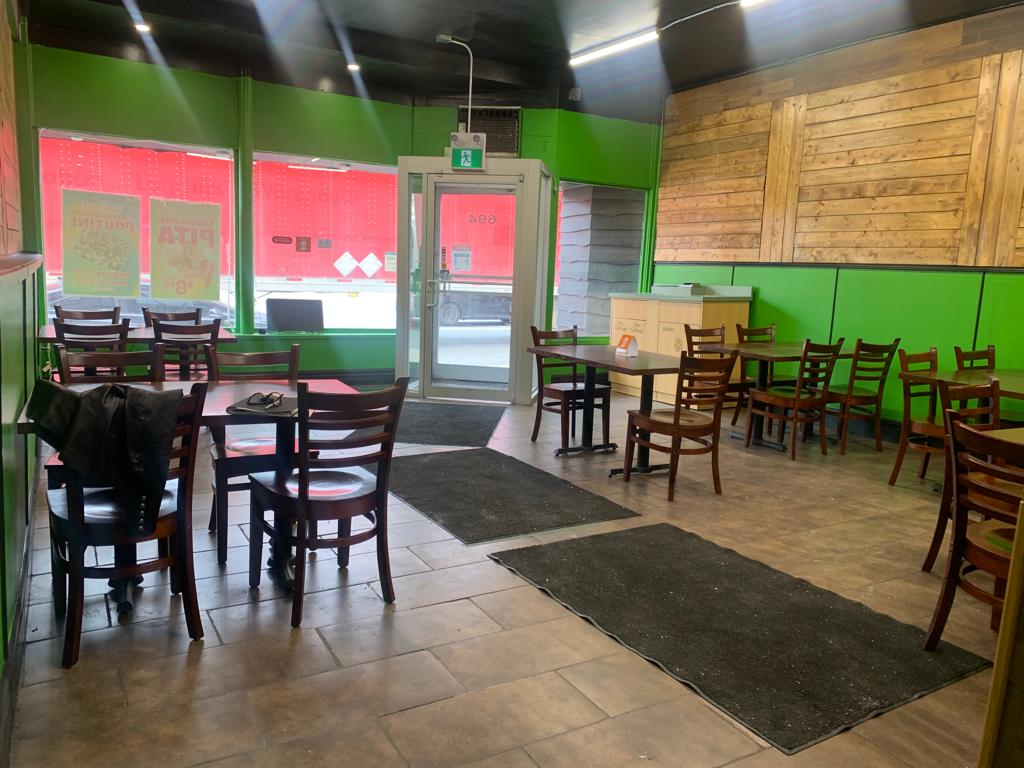 table and chairs with green wall